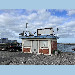 GNSS antenna and corner reflectors on top of the tide gauge building